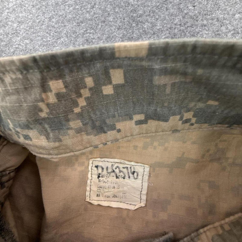 Khaki and green camouflage button-up shirt with multiple pockets #camouflage