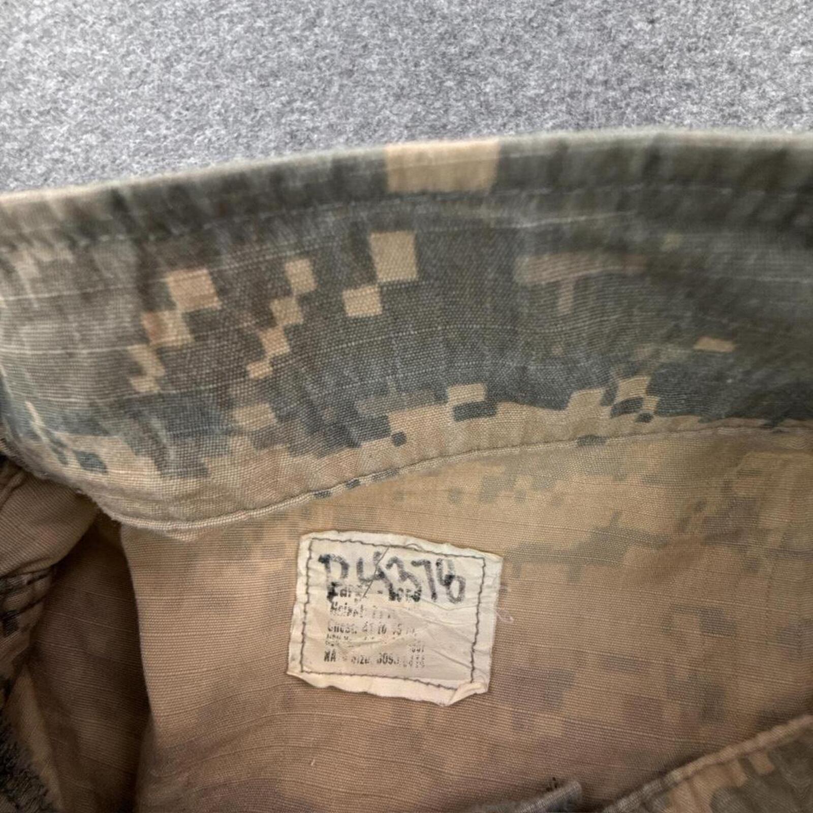 Khaki and green camouflage button-up shirt with multiple pockets #camouflage