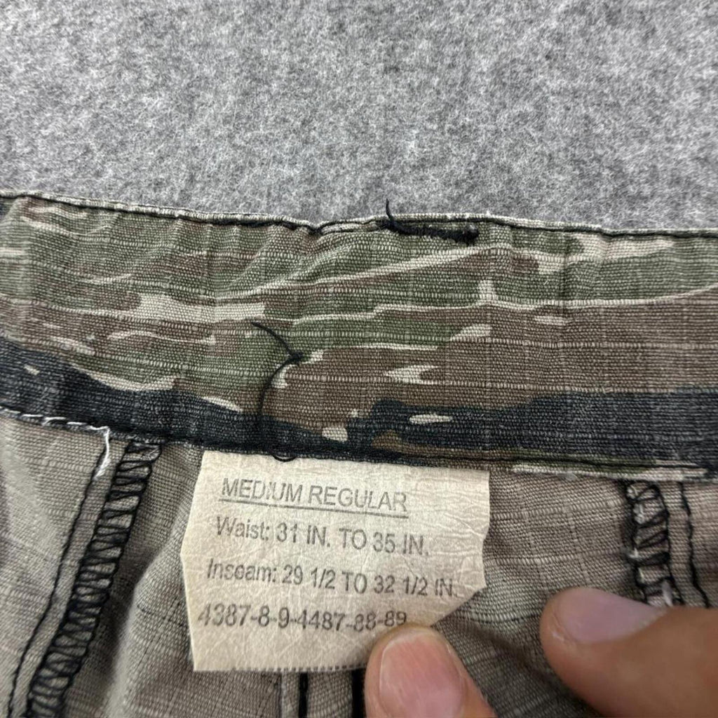 Khaki and green camouflage cargo pants with adjustable waist #techwear