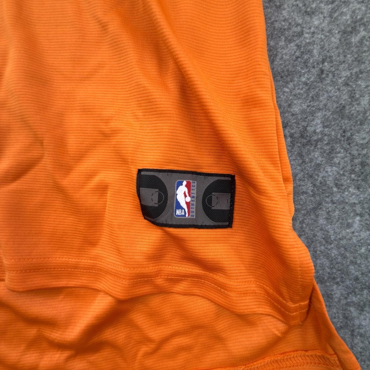 Fanatics Women’s NBA Phoenix Suns Devin Booker Short-sleeved Jersey in Orange