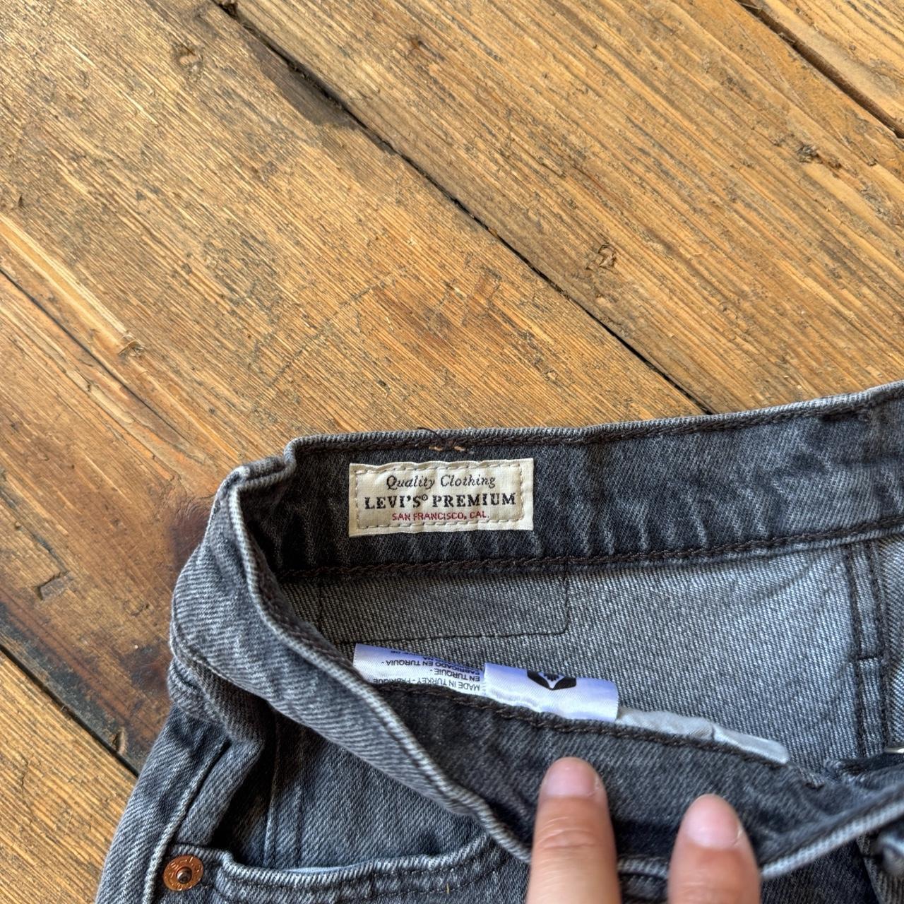 Levi's 501 Women’s Frayed Hem Denim Booty Shorts in Washed Black W24